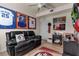 Relaxing game room, featuring framed jerseys and a comfortable couch at 12550 Ghiberti Cir # 101, Venice, FL 34293