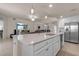 Eat-in kitchen with island, stainless steel appliances, and white cabinets at 12550 Ghiberti Cir # 101, Venice, FL 34293