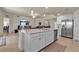 Kitchen island with white cabinets and granite countertops at 12550 Ghiberti Cir # 101, Venice, FL 34293
