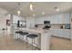 Modern kitchen with stainless steel appliances and an island at 12550 Ghiberti Cir # 101, Venice, FL 34293
