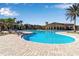 Large resort-style pool with plenty of lounge chairs at 12550 Ghiberti Cir # 101, Venice, FL 34293