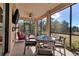 Peaceful screened porch with seating and outdoor views at 12550 Ghiberti Cir # 101, Venice, FL 34293
