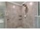 Large walk in shower with tile surround and dual shower heads at 12550 Ghiberti Cir # 101, Venice, FL 34293