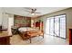 Main bedroom with wood furniture, and sliding glass doors at 1737 Bonitas Cir # 1724D, Venice, FL 34293