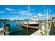 Boat docked at a marina with clear water and blue sky at 1737 Bonitas Cir # 1724D, Venice, FL 34293