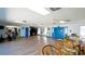 Spacious community room with seating and fitness area at 1737 Bonitas Cir # 1724D, Venice, FL 34293
