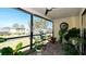 Lush enclosed patio with tiled floor and many potted plants at 1737 Bonitas Cir # 1724D, Venice, FL 34293