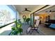 Relaxing enclosed patio with tiled floor and comfortable seating at 1737 Bonitas Cir # 1724D, Venice, FL 34293