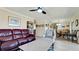 Open concept living and dining area with hardwood floors at 1737 Bonitas Cir # 1724D, Venice, FL 34293