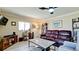 Living room features leather furniture and a granite coffee table at 1737 Bonitas Cir # 1724D, Venice, FL 34293