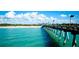 Stunning ocean pier view with beach and blue water at 1737 Bonitas Cir # 1724D, Venice, FL 34293