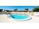 Community pool with lounge chairs and plenty of space for relaxing at 1737 Bonitas Cir # 1724D, Venice, FL 34293