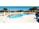 Inviting kidney-shaped community pool with ample lounge chairs at 1737 Bonitas Cir # 1724D, Venice, FL 34293
