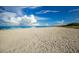 Expansive sandy beach under a bright blue sky at 176 Avens Dr, Nokomis, FL 34275