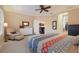 Bright bedroom with a comfortable seating area and large bed at 176 Avens Dr, Nokomis, FL 34275