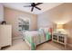 Charming bedroom with metal bed frame and window seating at 176 Avens Dr, Nokomis, FL 34275