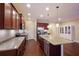 Modern kitchen with granite countertops and stainless steel appliances at 176 Avens Dr, Nokomis, FL 34275