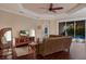Living room with hardwood floors, sliding doors, and a view of the pool at 176 Avens Dr, Nokomis, FL 34275