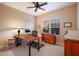 Home office with wood desk and window views at 176 Avens Dr, Nokomis, FL 34275