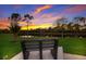 Serene pond view with a bench, perfect for relaxing evenings at 176 Avens Dr, Nokomis, FL 34275
