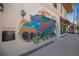 Colorful murals adorn the buildings, adding artistic flair to the streetscape at 176 Avens Dr, Nokomis, FL 34275