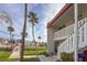 Building exterior with walkway and landscaping at 1801 Gulf N Dr # 121, Bradenton Beach, FL 34217