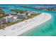 Aerial view of beachfront property with resort and white sand beach at 250 Sands Point Rd # 5105, Longboat Key, FL 34228
