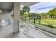 Private balcony overlooking lush tropical landscape at 250 Sands Point Rd # 5105, Longboat Key, FL 34228