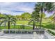 Scenic balcony view overlooking lush landscaping and a tranquil waterway at 250 Sands Point Rd # 5105, Longboat Key, FL 34228