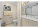 Clean bathroom with toilet and a double vanity at 250 Sands Point Rd # 5105, Longboat Key, FL 34228