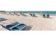 Beachfront with lounge chairs and umbrellas at 250 Sands Point Rd # 5105, Longboat Key, FL 34228