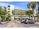 Modern building exterior with ample parking at 250 Sands Point Rd # 5105, Longboat Key, FL 34228