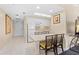 Small, well-equipped kitchen with white cabinetry and breakfast bar at 250 Sands Point Rd # 5105, Longboat Key, FL 34228