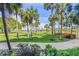 Lush landscaping with palm trees and manicured grounds at 250 Sands Point Rd # 5105, Longboat Key, FL 34228