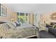 Main bedroom with king-size bed, sitting area, and balcony access at 250 Sands Point Rd # 5105, Longboat Key, FL 34228