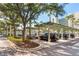 Covered parking area with lush landscaping at 250 Sands Point Rd # 5105, Longboat Key, FL 34228