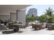 Outdoor seating area featuring comfortable seating and lush landscaping at 325 Golden Gate Pt # 704, Sarasota, FL 34236