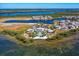 Aerial view of waterfront community with pool and clubhouse at 326 Compass Point Dr # 201, Bradenton, FL 34209