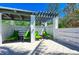 Relaxing shaded pergola with green lounge chairs at 326 Compass Point Dr # 201, Bradenton, FL 34209