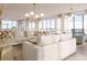 Bright living room with city views, plush sofas, and modern light fixtures at 33 S Palm Ave # 1601, Sarasota, FL 34236