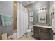 Clean bathroom with shower/tub combo and modern vanity at 330 Compass Point Dr # 101, Bradenton, FL 34209