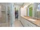 Bathroom with double vanity, walk-in closet, and shower at 330 Compass Point Dr # 101, Bradenton, FL 34209