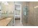 Bathroom with shower, vanity, and bedroom view at 330 Compass Point Dr # 101, Bradenton, FL 34209