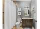 Elegant bathroom with a dark vanity and shimmering walls at 330 Compass Point Dr # 101, Bradenton, FL 34209