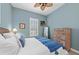 Bright bedroom with a queen-size bed and coastal decor at 330 Compass Point Dr # 101, Bradenton, FL 34209