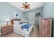 Guest bedroom with a queen-size bed and coastal decor at 330 Compass Point Dr # 101, Bradenton, FL 34209