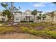 Two-story home with a welcoming front porch and beautifully landscaped yard at 330 Compass Point Dr # 101, Bradenton, FL 34209