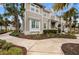 Tan house with white trim, landscaping, and a walkway leading to the entrance at 330 Compass Point Dr # 101, Bradenton, FL 34209