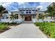 Community clubhouse with double doors and landscaping at 330 Compass Point Dr # 101, Bradenton, FL 34209