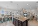 Modern kitchen with a large island, breakfast bar, and stainless steel appliances at 330 Compass Point Dr # 101, Bradenton, FL 34209